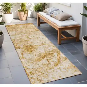 Photo of 8' Runner Cream and Gold Abstract Washable Non Skid Indoor Outdoor Runner Rug