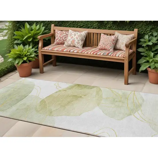 Green and Ivory Abstract Washable Non Skid Indoor Outdoor Runner Rug Photo 1