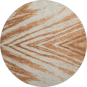 Photo of 8' Rust And Beige Abstract Washable Round Rug With UV Protection