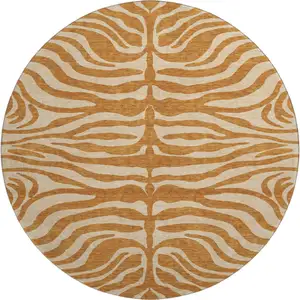 Photo of 8' Rust And Beige Animal Print Washable Round Rug With UV Protection
