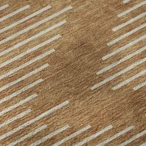 Photo of 8' Rust And Beige Geometric Washable Round Rug With UV Protection