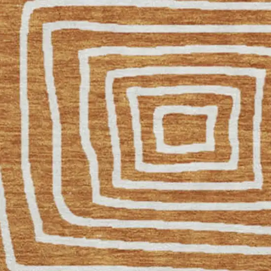 8' Rust And Beige Geometric Washable Round Rug With UV Protection Photo 2