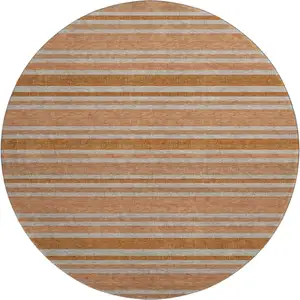 Photo of 8' Rust And Beige Striped Washable Round Rug With UV Protection