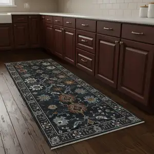 Photo of 8' Rust And Black Oriental Runner Rug With Fringe