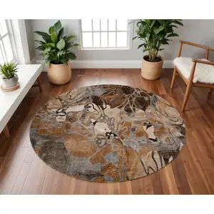 Photo of 8' Rust And Gray Floral Washable Round Rug With UV Protection