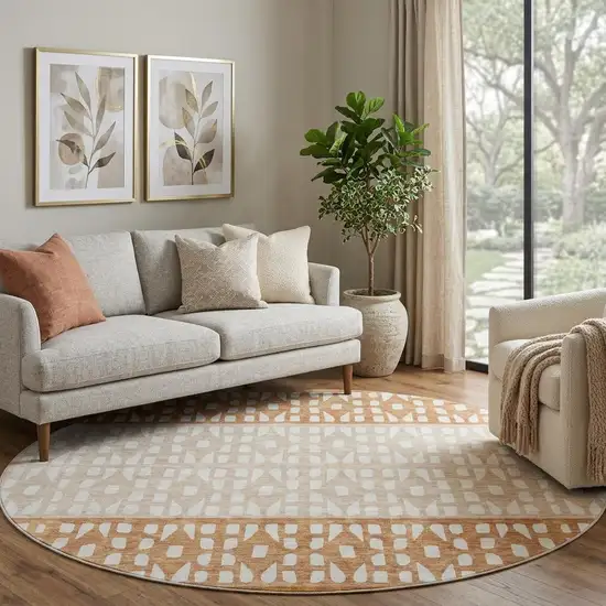 8' Rust And Ivory Geometric Washable Round Rug With UV Protection Photo 1