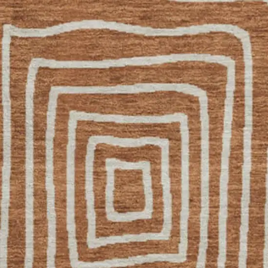 8' Rust And Ivory Geometric Washable Round Rug With UV Protection Photo 2