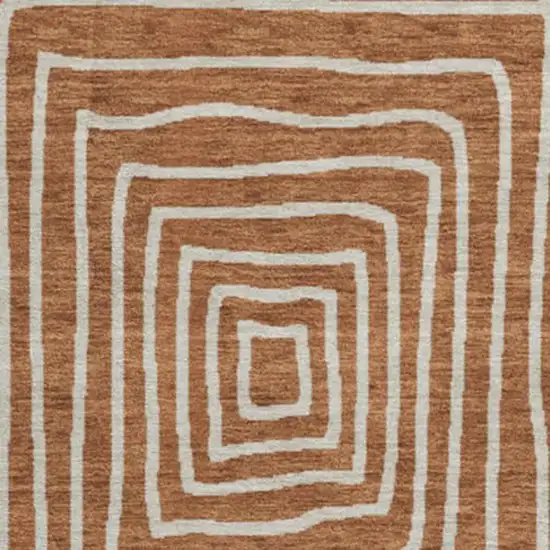 8' Rust And Ivory Geometric Washable Round Rug With UV Protection Photo 3