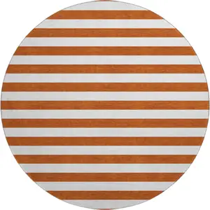 Photo of 8' Rust And Ivory Striped Washable Round Rug With UV Protection