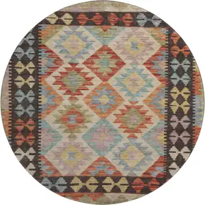 Photo of 8' Rust Blue And Beige Tribal Washable Round Rug With UV Protection