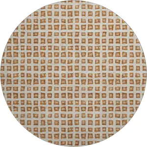 Photo of 8' Rust Copper And Beige Geometric Washable Round Rug With UV Protection