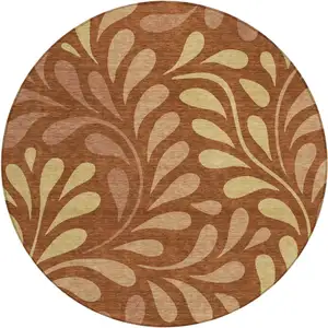 Photo of 8' Rust Copper And Gold Round Botanical Leaves Washable Indoor Outdoor Area Rug