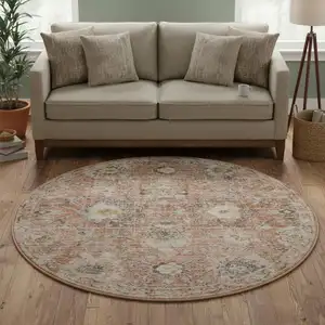 Photo of 8' Rust Green And Black Floral Distressed Round Rug