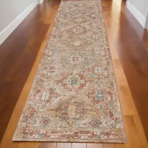 Photo of 10' Rust Ivory And Blue Geometric Distressed Runner Rug