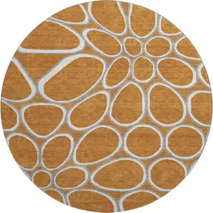 Photo of 8' Rust Ivory And Gray Geometric Washable Round Rug With UV Protection