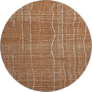 Photo of 8' Rust Ivory And Gray Striped Washable Round Rug With UV Protection