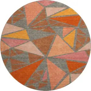Photo of 8' Rust Orange And Salmon Geometric Washable Round Rug With UV Protection