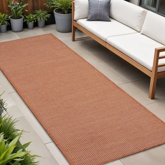8' Rust Indoor Outdoor Runner Rug Photo 1