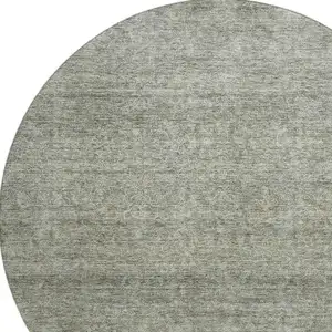 Photo of 8' Sage And Beige Abstract Washable Round Rug With UV Protection