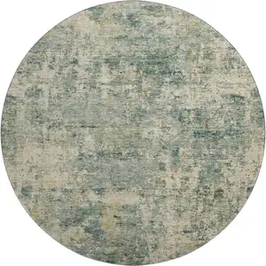 Photo of 8' Sage And Beige Abstract Washable Round Rug With UV Protection