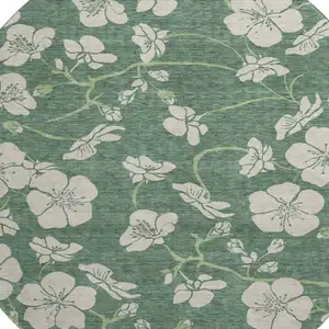 Photo of 8' Sage And Beige Floral Washable Round Rug With UV Protection