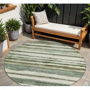 Photo of 8' Sage And Beige Round Striped Washable Indoor Outdoor Area Rug
