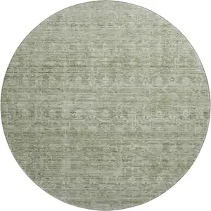 Photo of 8' Sage And Beige Striped Washable Round Rug With UV Protection
