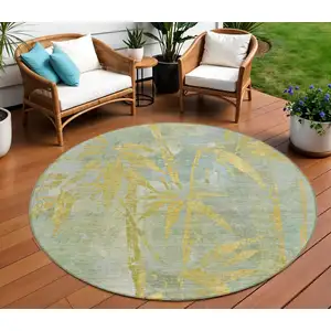 Photo of 8' Sage And Gold Round Botanical Leaves Washable Indoor Outdoor Area Rug