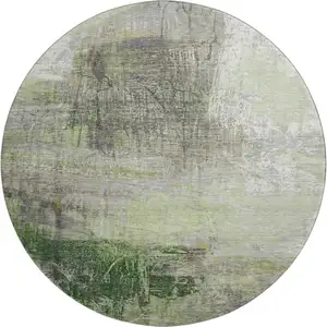 Photo of 8' Sage And Ivory Abstract Washable Round Rug With UV Protection