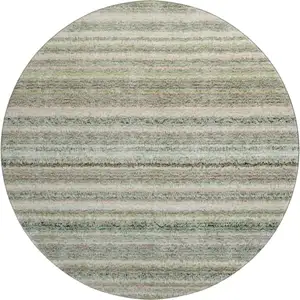 Photo of 8' Sage And Ivory Striped Washable Round Rug With UV Protection