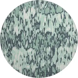 Photo of 8' Sage And Ivory Striped Washable Round Rug With UV Protection