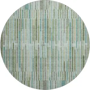 Photo of 8' Sage And Teal Striped Washable Round Rug With UV Protection