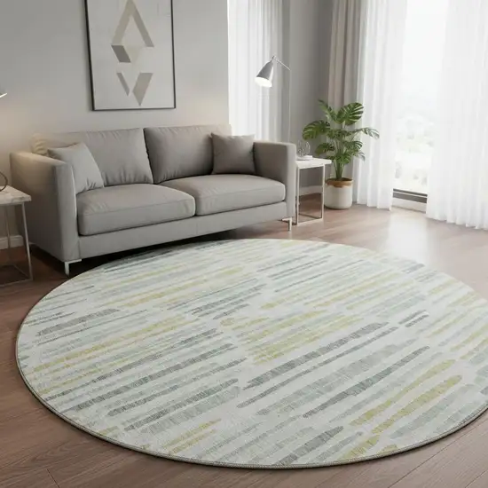 8' Sage Gold And Ivory Abstract Washable Round Rug With UV Protection Photo 2