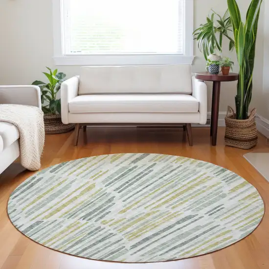 8' Sage Gold And Ivory Abstract Washable Round Rug With UV Protection Photo 5