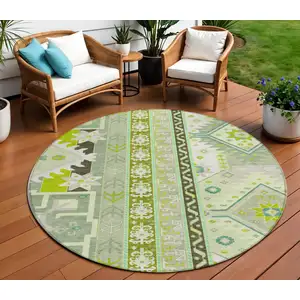 Photo of 8' Sage Olive Green And Ivory Round Aztec Washable Indoor Outdoor Area Rug