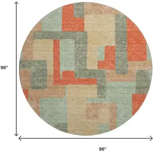 Photo of 8' Sage Orange And Beige Geometric Washable Round Rug With UV Protection