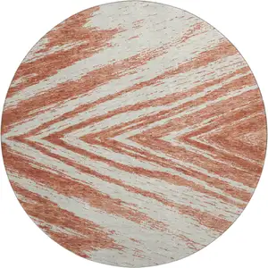 Photo of 8' Salmon And Beige Abstract Washable Round Rug With UV Protection