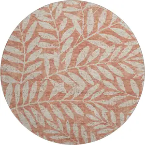 Photo of 8' Salmon And Beige Floral Washable Round Rug With UV Protection