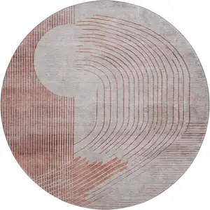 Photo of 8' Salmon And Beige Geometric Washable Round Rug With UV Protection