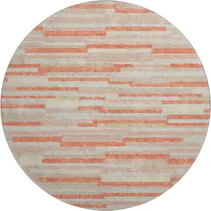 Photo of 8' Salmon And Beige Striped Washable Round Rug With UV Protection