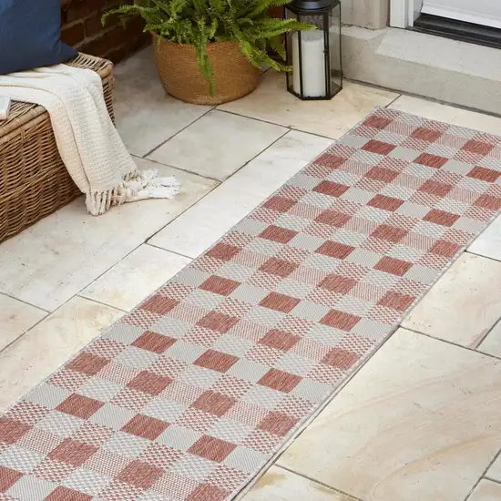 8' Salmon And Cream Geometric Indoor Outdoor Runner Rug Photo 4