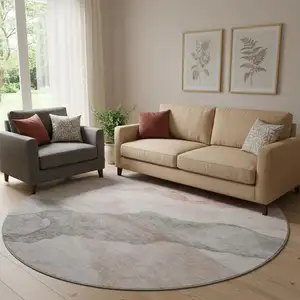 Photo of 8' Salmon And Gray Abstract Washable Round Rug With UV Protection