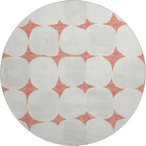Photo of 8' Salmon And Ivory Abstract Geometric Washable Round Rug With UV Protection