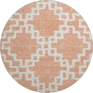 Photo of 8' Salmon And Ivory Abstract Geometric Washable Round Rug With UV Protection