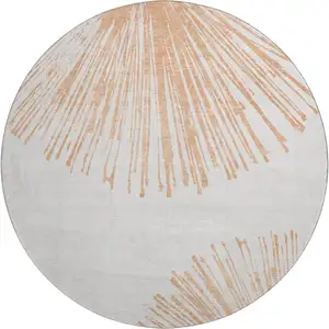 Photo of 8' Salmon And Ivory Abstract Washable Round Rug With UV Protection