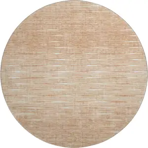 Photo of 8' Salmon And Ivory Abstract Washable Round Rug With UV Protection