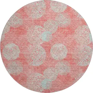 Photo of 8' Salmon And Ivory Abstract Washable Round Rug With UV Protection