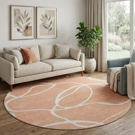 8' Salmon And Ivory Abstract Washable Round Rug With UV Protection Photo 1
