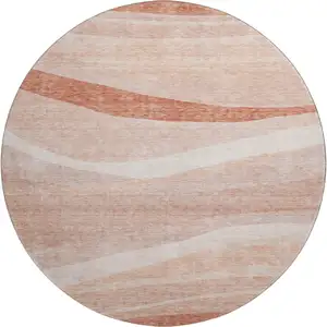 Photo of 8' Salmon And Ivory Abstract Washable Round Rug With UV Protection
