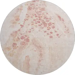 Photo of 8' Salmon And Ivory Abstract Washable Round Rug With UV Protection